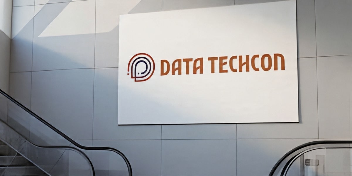 Logo of Data Techcon displayed on a wall, representing a transformative initiative empowering underrepresented communities through AI and data.