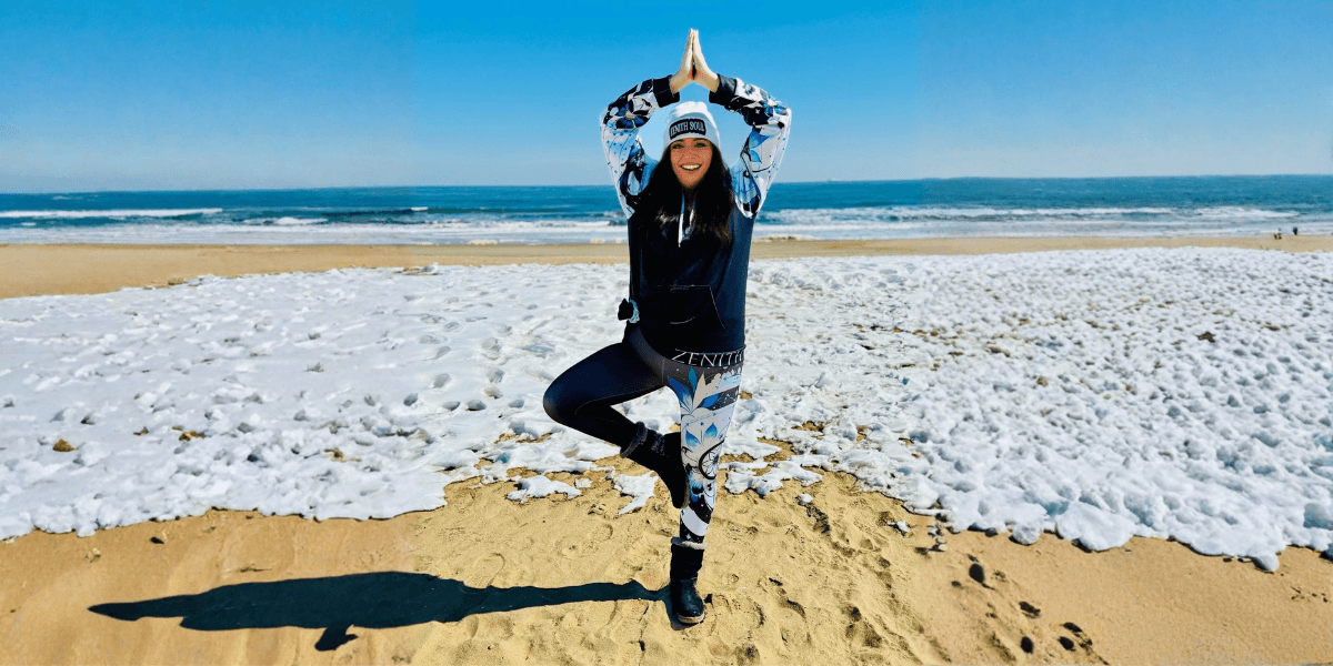 "Kimberly Vega, Army veteran and founder of Zenith Soul, demonstrates yoga on the beach, promoting mind-body-spirit healing and empowerment."