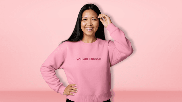 "Ara Jaingue, founder of Mama Tribe United, speaking at an event, promoting healing through science-backed affirmation apparel for mothers."