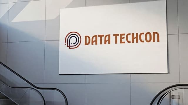 Logo of Data Techcon displayed on a wall, representing a transformative initiative empowering underrepresented communities through AI and data.