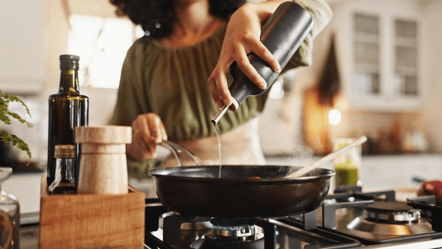 a woman cooking, reflecting Simply Stocked’s mission to simplify mealtime for busy families with ease.
