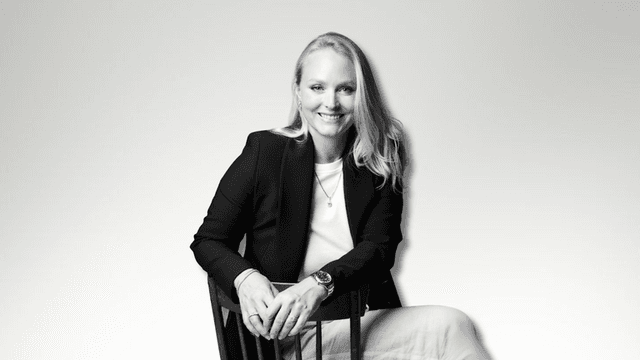Milena Dold, founder of IRALIS, confidently seated and smiling, embodies the empowerment and luxury of self-purchased diamonds, symbolizing independence, achievement, and a redefined approach to personal milestones in the jewelry industry.